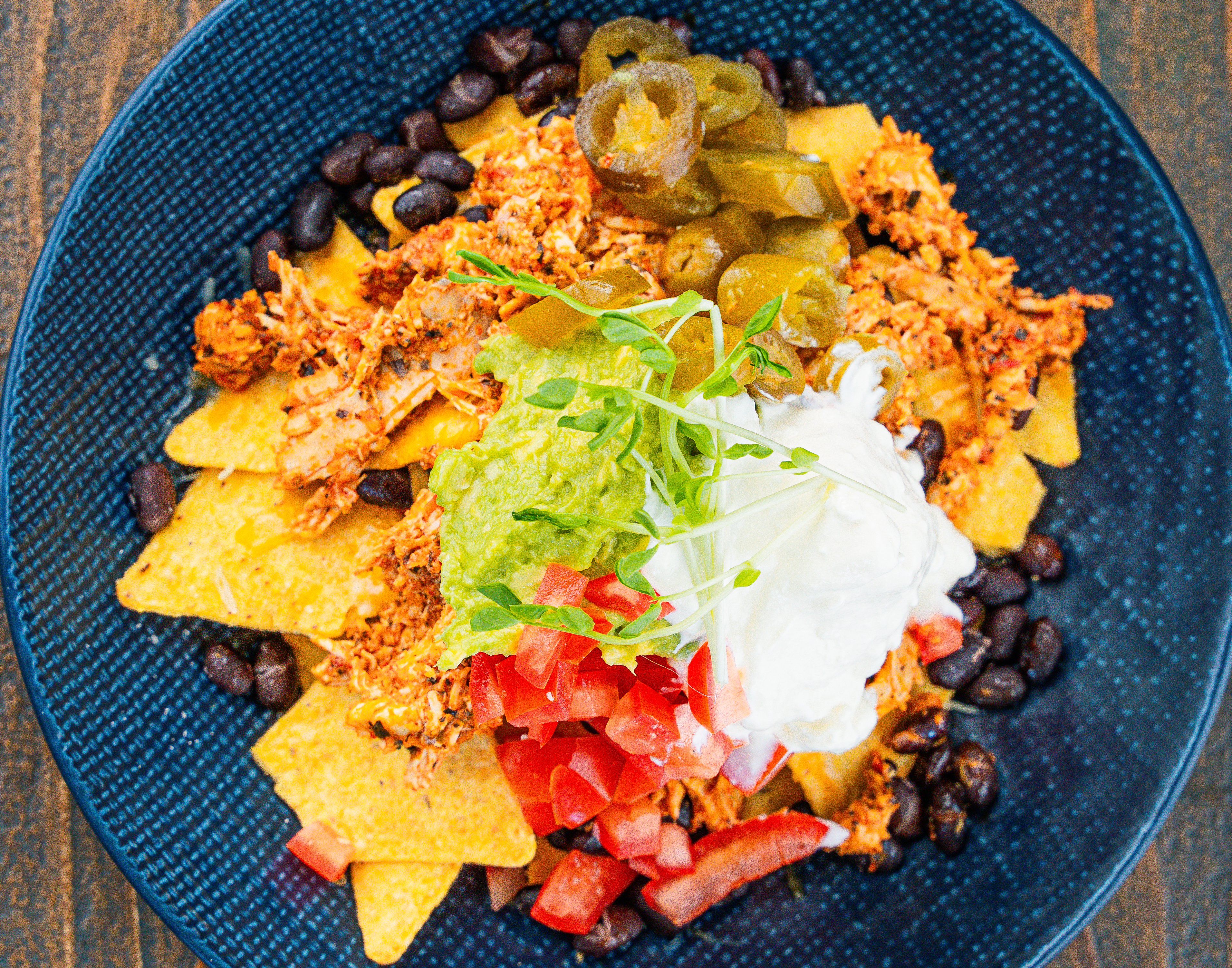 Chicken Nachos with spicy buffalo sauce